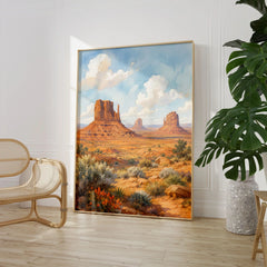 Monument Valley the Mittens buttes watercolour art print large framed print beside a chair and plant