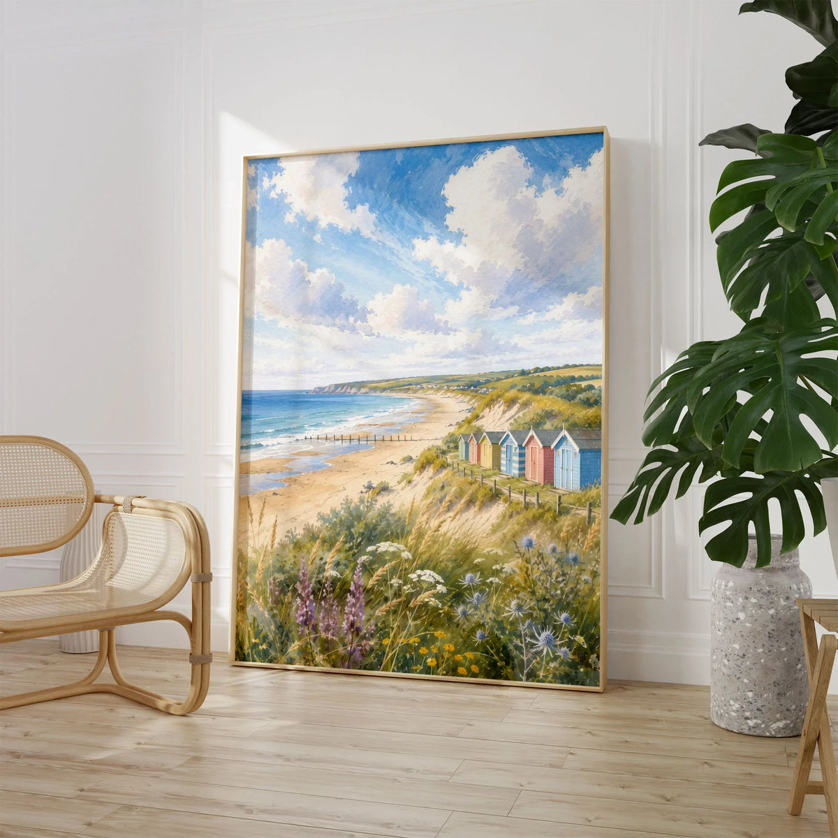 Norfolk Coast beach huts and sandy beach watercolour art print large framed print beside a chair and plant
