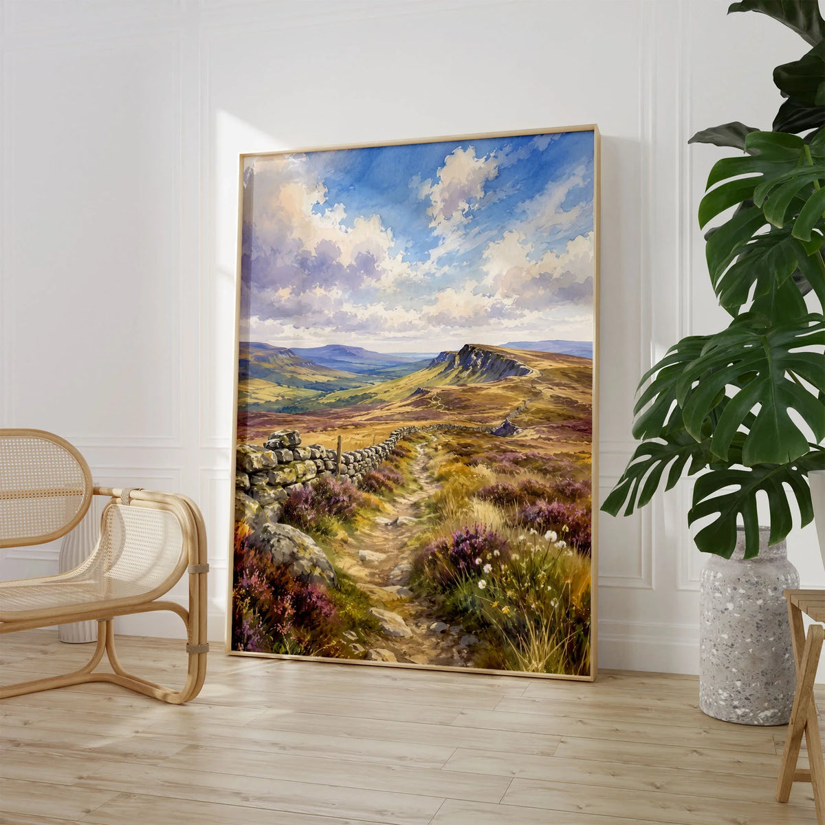 North Pennines moorland path and stone wall watercolour art print large framed print beside a chair and plant
