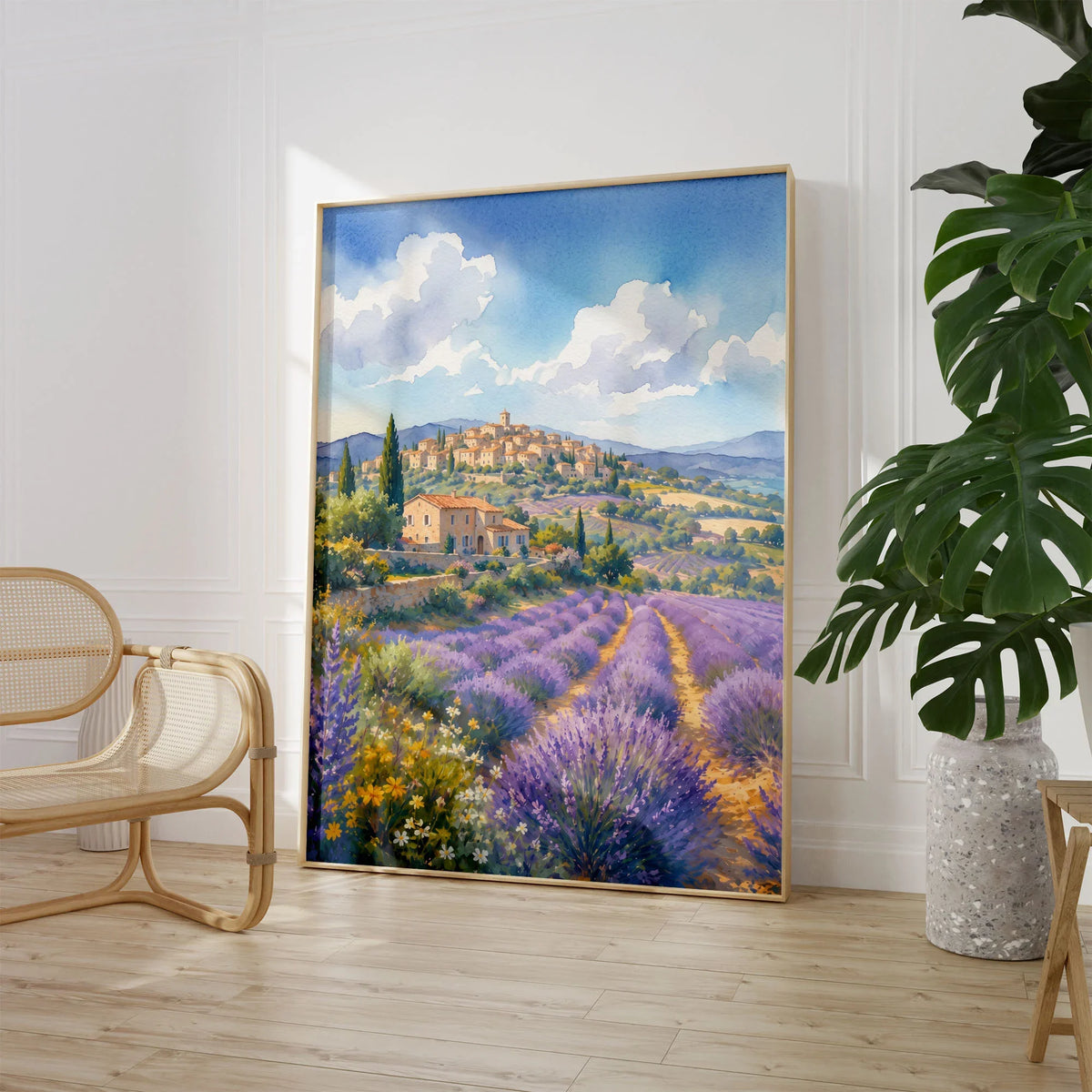Provence lavender fields and hilltop village watercolour art print large framed print beside a chair and plant