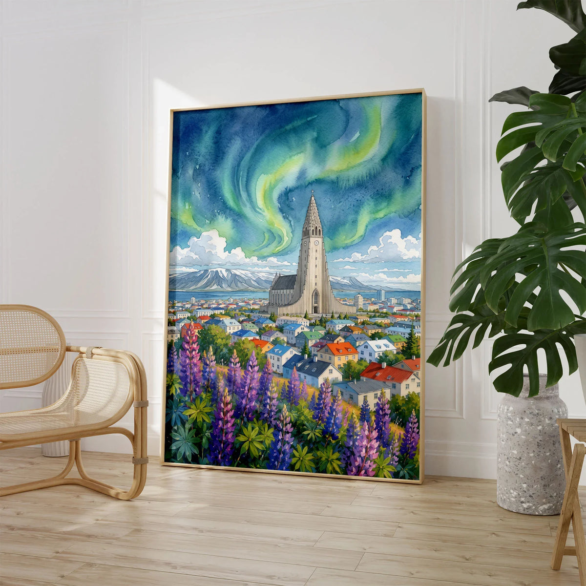 Reykjavik Hallgrímskirkja and northern lights watercolour art print large framed print beside a chair and plant