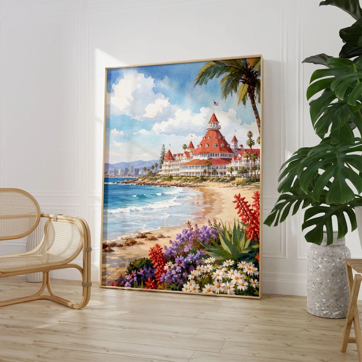 San Diego Hotel del Coronado and beach watercolour art print large framed print beside a chair and plant