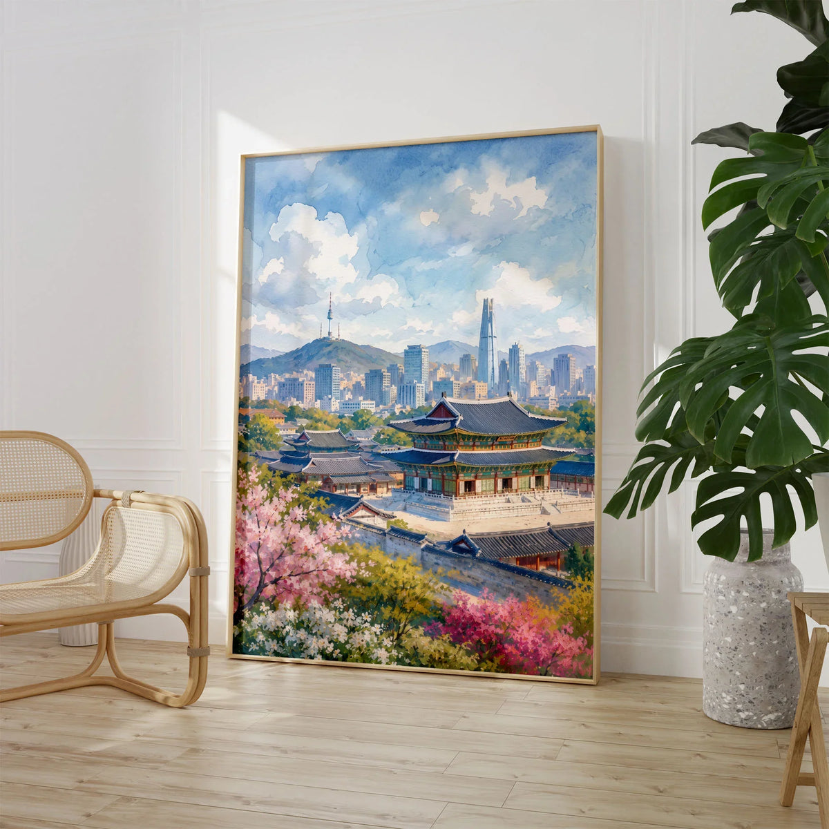 Seoul Gyeongbokgung Palace and skyline watercolour art print large framed print beside a chair and plant
