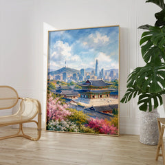 Seoul Gyeongbokgung Palace and skyline watercolour art print large framed print beside a chair and plant