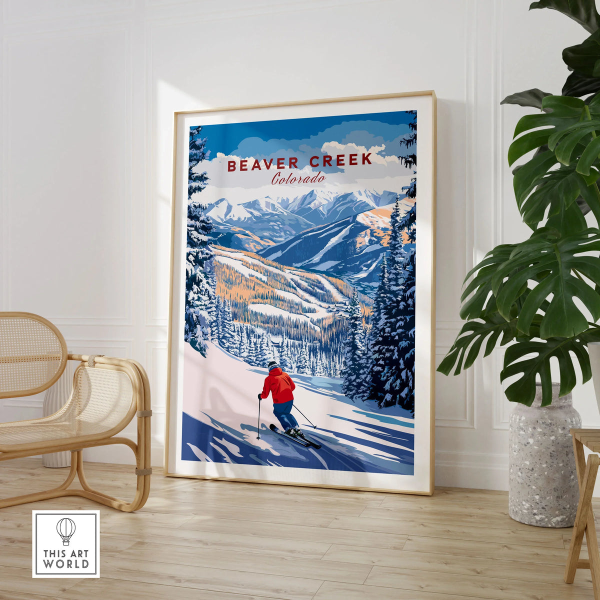 Beaver Creek Colorado Downhill Skier Poster - Winter Sports Wall Art in a large natural wood frame leaning in a room with a rattan chair and monstera plant