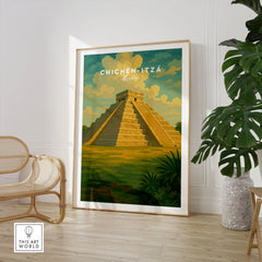 Chichén Itzá Mexico El Castillo Pyramid Travel Print Mayan Landscape Poster Wall Art in a large natural wood frame leaning in a room with a rattan chair and monstera plant