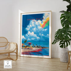 Cocoa Beach Lifeguard Stand Print - Florida Beach Wall Art in a large natural wood frame leaning in a room with a rattan chair and monstera plant