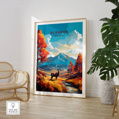 Glencoe Art Print in a large natural wood frame leaning in a room with a rattan chair and monstera plant
