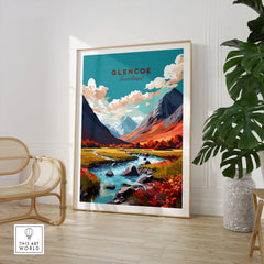Glencoe Poster Print in a large natural wood frame leaning in a room with a rattan chair and monstera plant