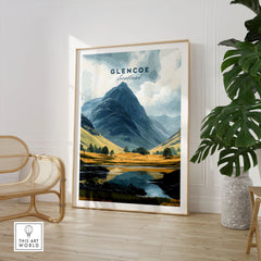 Glencoe Travel Print in a large natural wood frame leaning in a room with a rattan chair and monstera plant