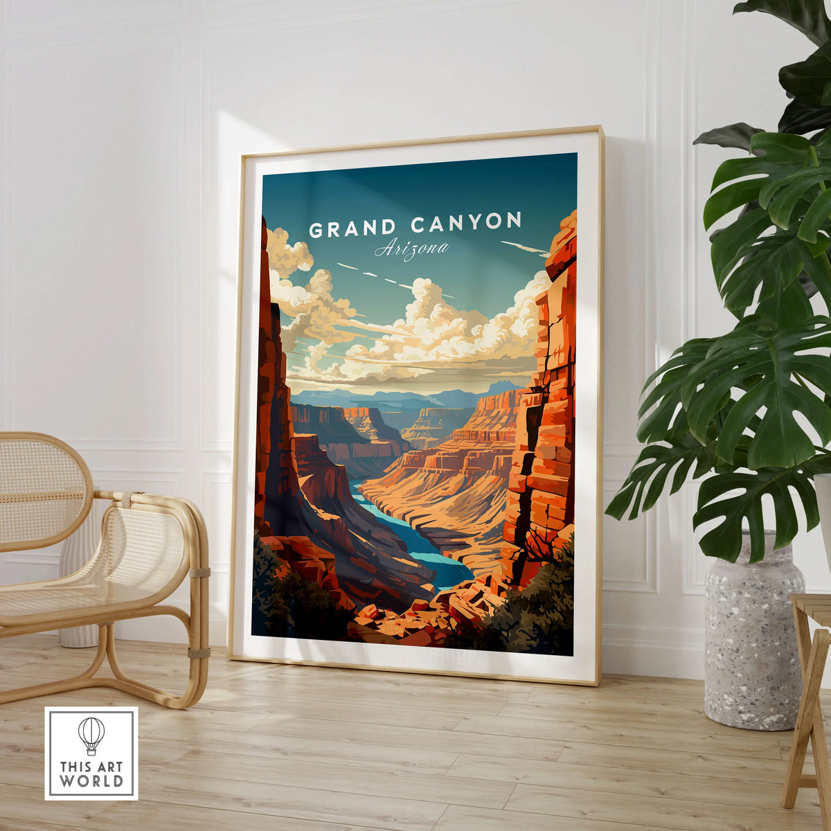 Grand Canyon Poster in a large natural wood frame leaning in a room with a rattan chair and monstera plant