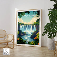 Iguazu Falls Print Argentina in a large natural wood frame leaning in a room with a rattan chair and monstera plant