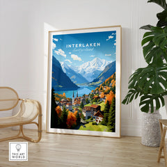 Interlaken Poster in a large natural wood frame leaning in a room with a rattan chair and monstera plant