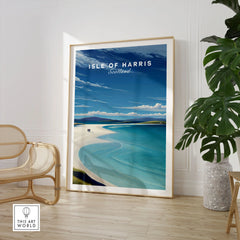 Isle of Harris Scotland Luskentyre Beach Print - White Sand Coastal Wall Art in a large natural wood frame leaning in a room with a rattan chair and monstera plant