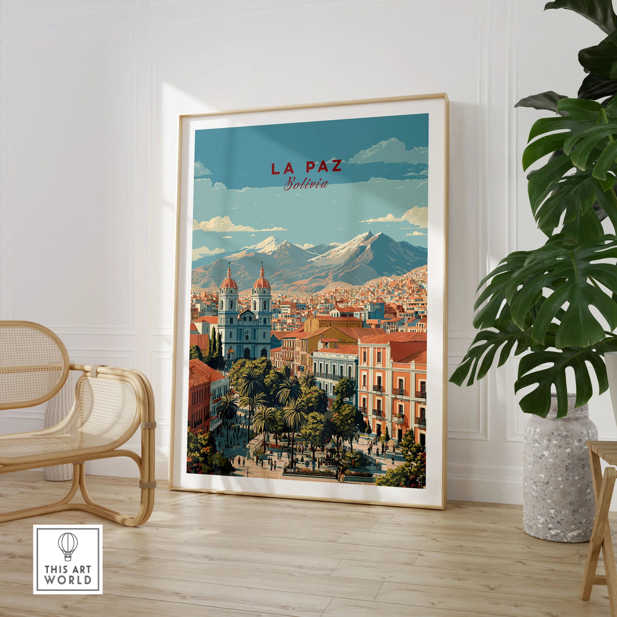 La Paz Travel Print - Bolivia Wall Art in a large natural wood frame leaning in a room with a rattan chair and monstera plant