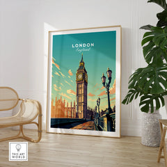 London Poster Big Ben in a large natural wood frame leaning in a room with a rattan chair and monstera plant