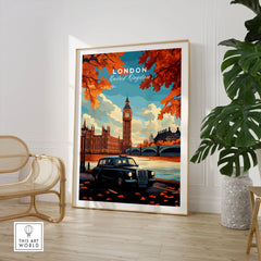 London Wall Art in a large natural wood frame leaning in a room with a rattan chair and monstera plant