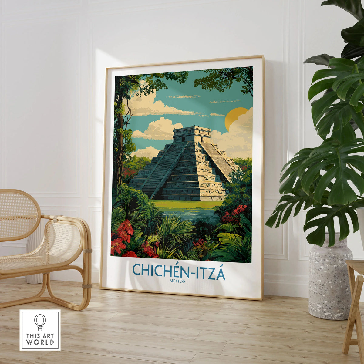 Mexico Chichén Itzá Mayan Pyramid Poster Jungle Ruins Travel Print El Castillo Art in a large natural wood frame leaning in a room with a rattan chair and monstera plant