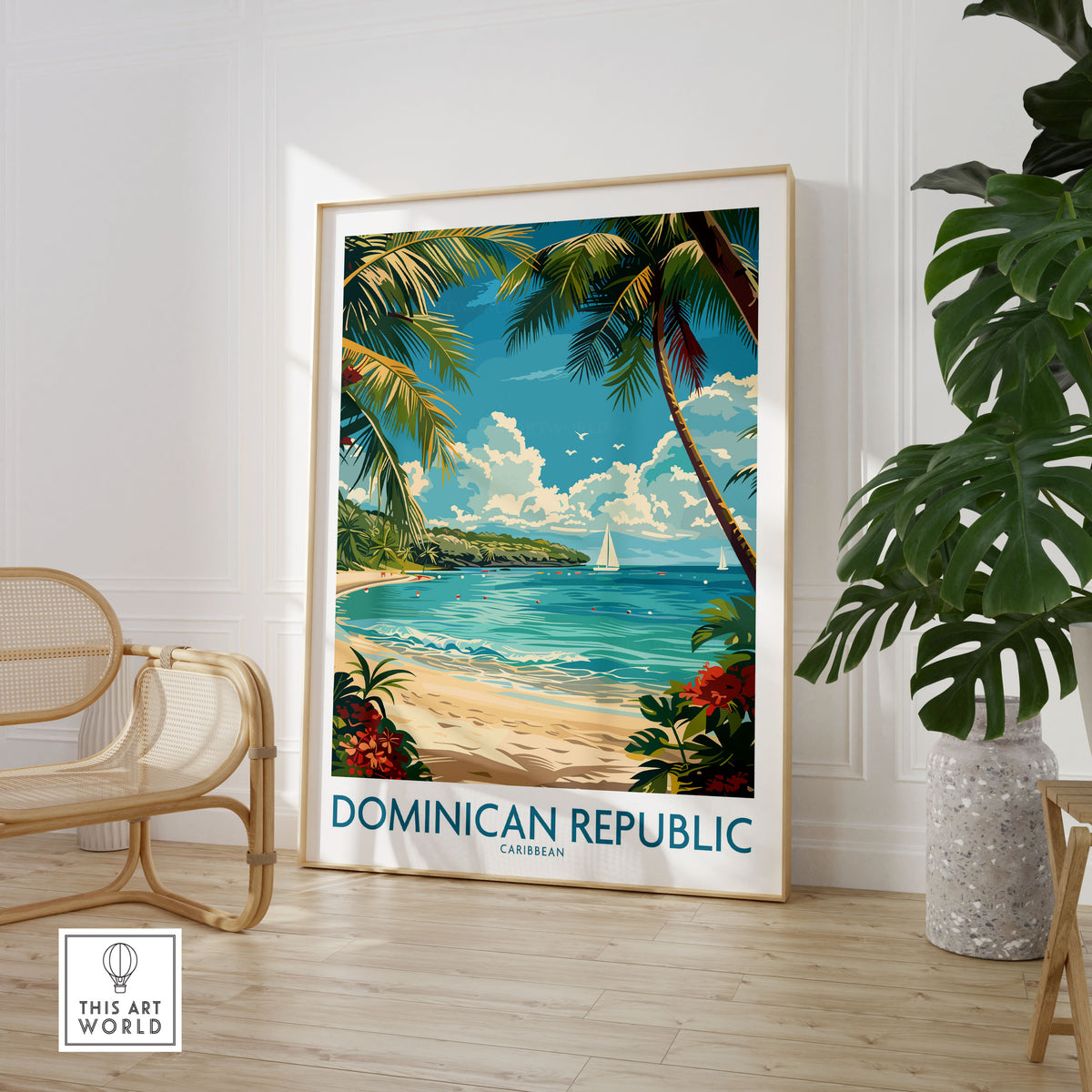 Dominican Republic Poster in a large natural wood frame leaning in a room with a rattan chair and monstera plant