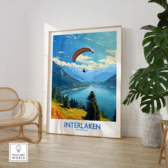 Interlaken Wall Art Print in a large natural wood frame leaning in a room with a rattan chair and monstera plant