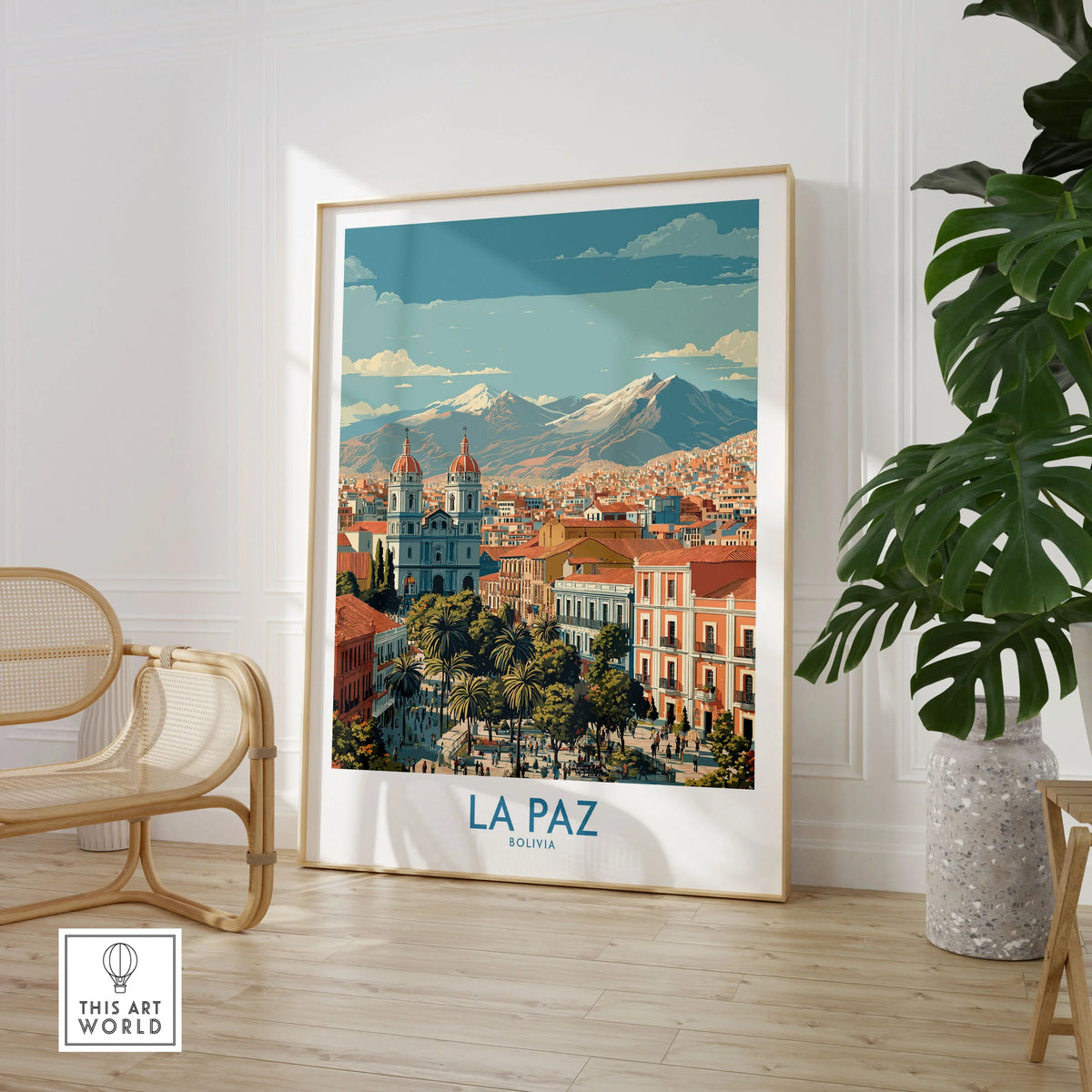 La Paz Bolivia Wall Art Poster - Bolivian Capital Travel Decor in a large natural wood frame leaning in a room with a rattan chair and monstera plant