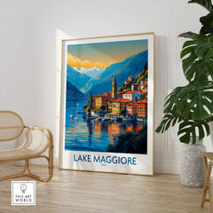 Lake Maggiore Italy Poster in a large natural wood frame leaning in a room with a rattan chair and monstera plant