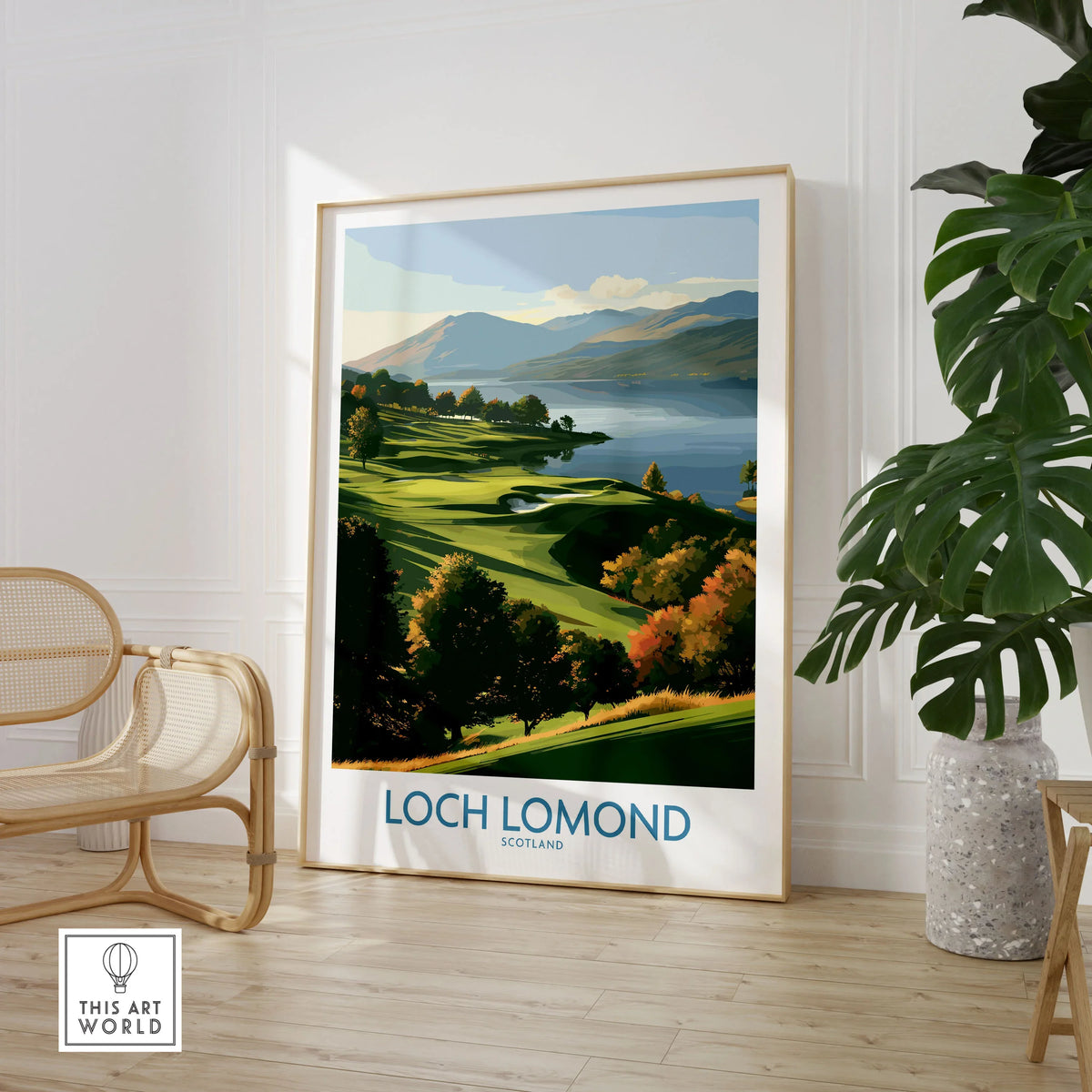 Loch Lomond Scotland Highland View Wall Art — autumn slopes rolling down to Loch Lomond with Highland hills beyond, shown as large framed print room setting chair plant