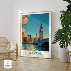 London Big Ben Wall Art | Modern Style in a large natural wood frame leaning in a room with a rattan chair and monstera plant
