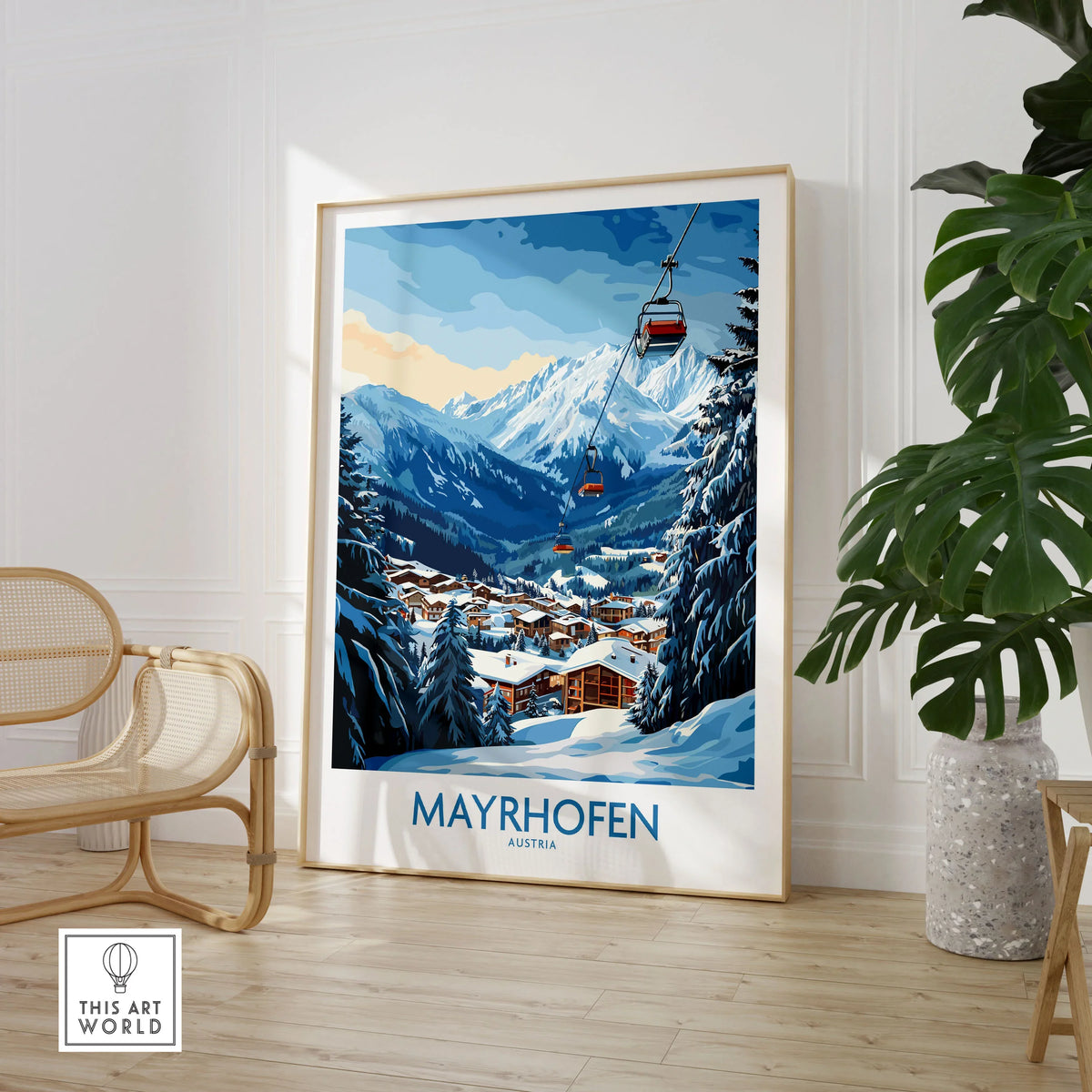 Mayrhofen Ski Poster in a large natural wood frame leaning in a room with a rattan chair and monstera plant