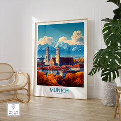 Munich Travel Poster in a large natural wood frame leaning in a room with a rattan chair and monstera plant