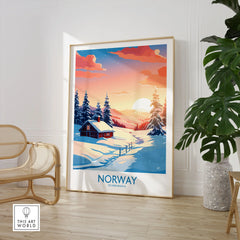 Norway Poster Print in a large natural wood frame leaning in a room with a rattan chair and monstera plant