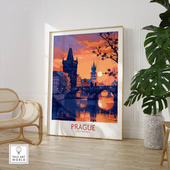 Prague Print in a large natural wood frame leaning in a room with a rattan chair and monstera plant