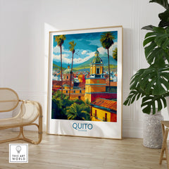 Ecuador Quito Cityscape Travel Print Poster Colonial Churches Andes Mountain Wall Art in a large natural wood frame leaning in a room with a rattan chair and monstera plant