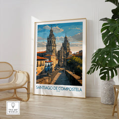 Santiago de Compostela Pilgrimage End Art Print | Cathedral Facade Poster in a large natural wood frame leaning in a room with a rattan chair and monstera plant