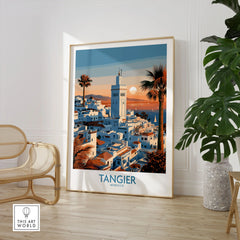 Tangier Morocco Sailboats and Rooftops Wall Art — Tangier medina rooftops and a minaret above a bay dotted with sails, shown as large framed print room setting chair plant