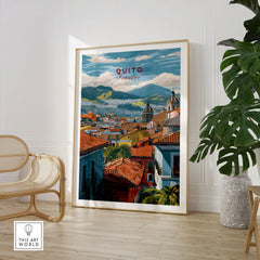 Quito Ecuador Travel Print Rooftop View Poster Cityscape Andes Hills Wall Art Decor in a large natural wood frame leaning in a room with a rattan chair and monstera plant