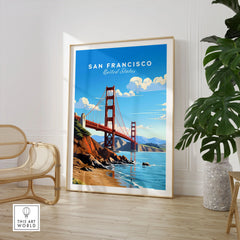 San Francisco Print in a large natural wood frame leaning in a room with a rattan chair and monstera plant