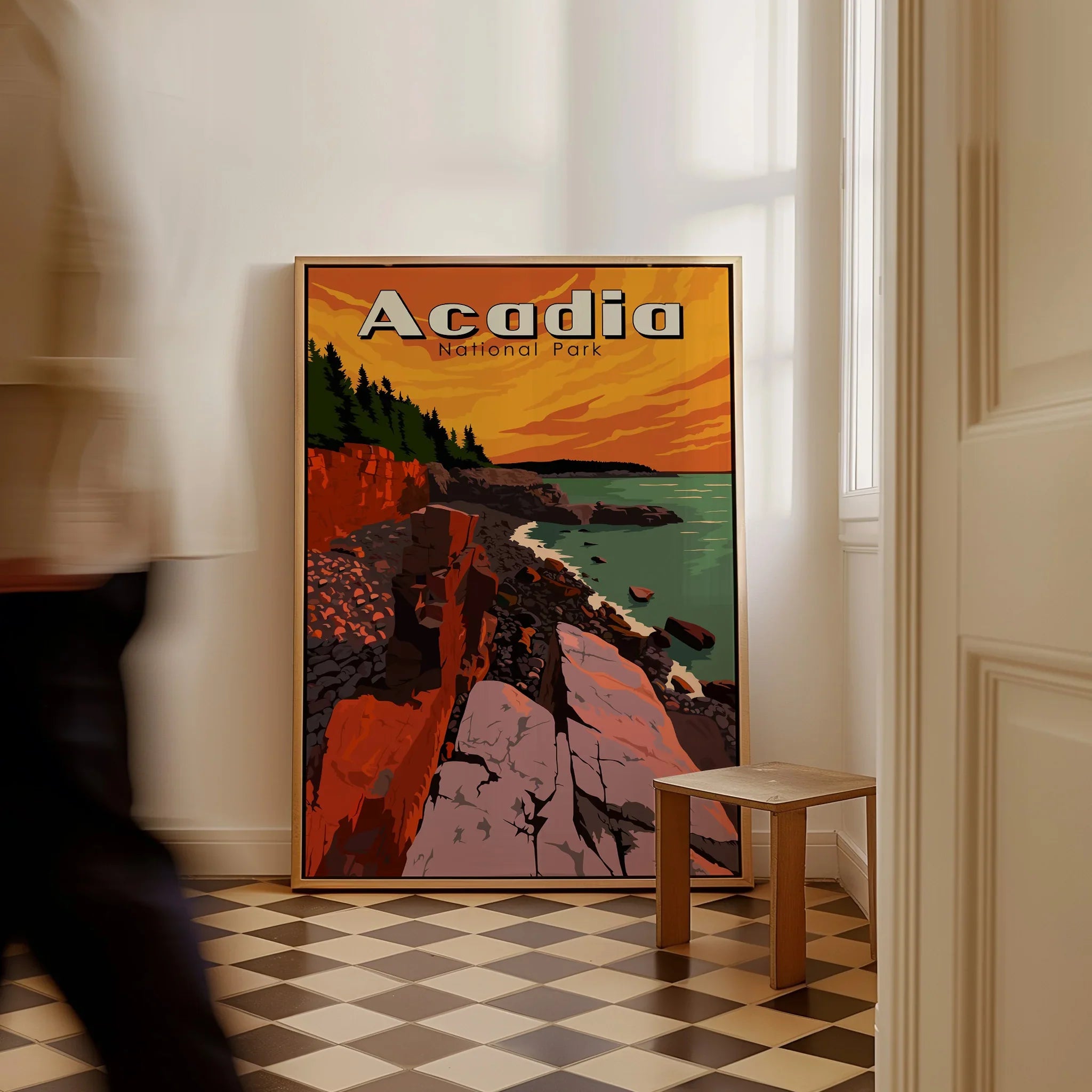 Acadia National Park travel poster framed on floor, coastal cliff art, man walking past