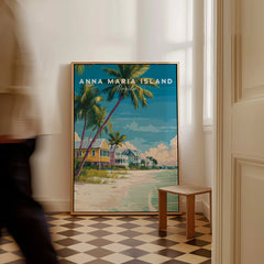Framed Anna Maria Island Florida travel poster with beach scene, resting on floor in bright hallway