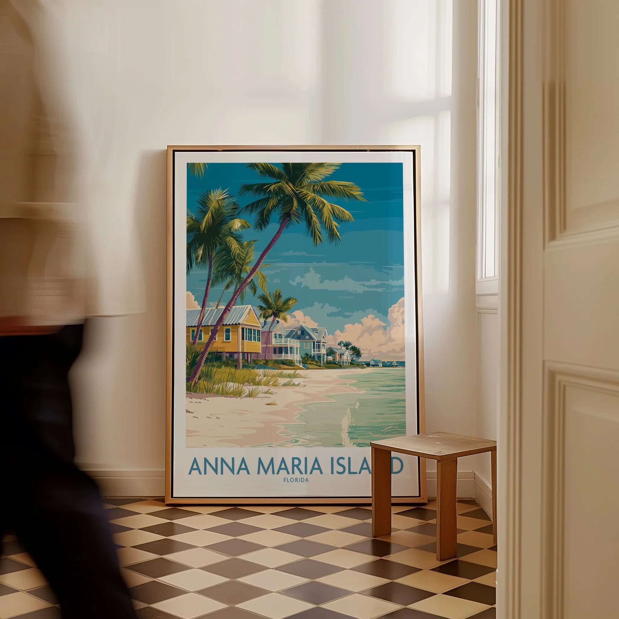 Framed Anna Maria Island Florida travel poster with palm trees and beach houses on floor.
