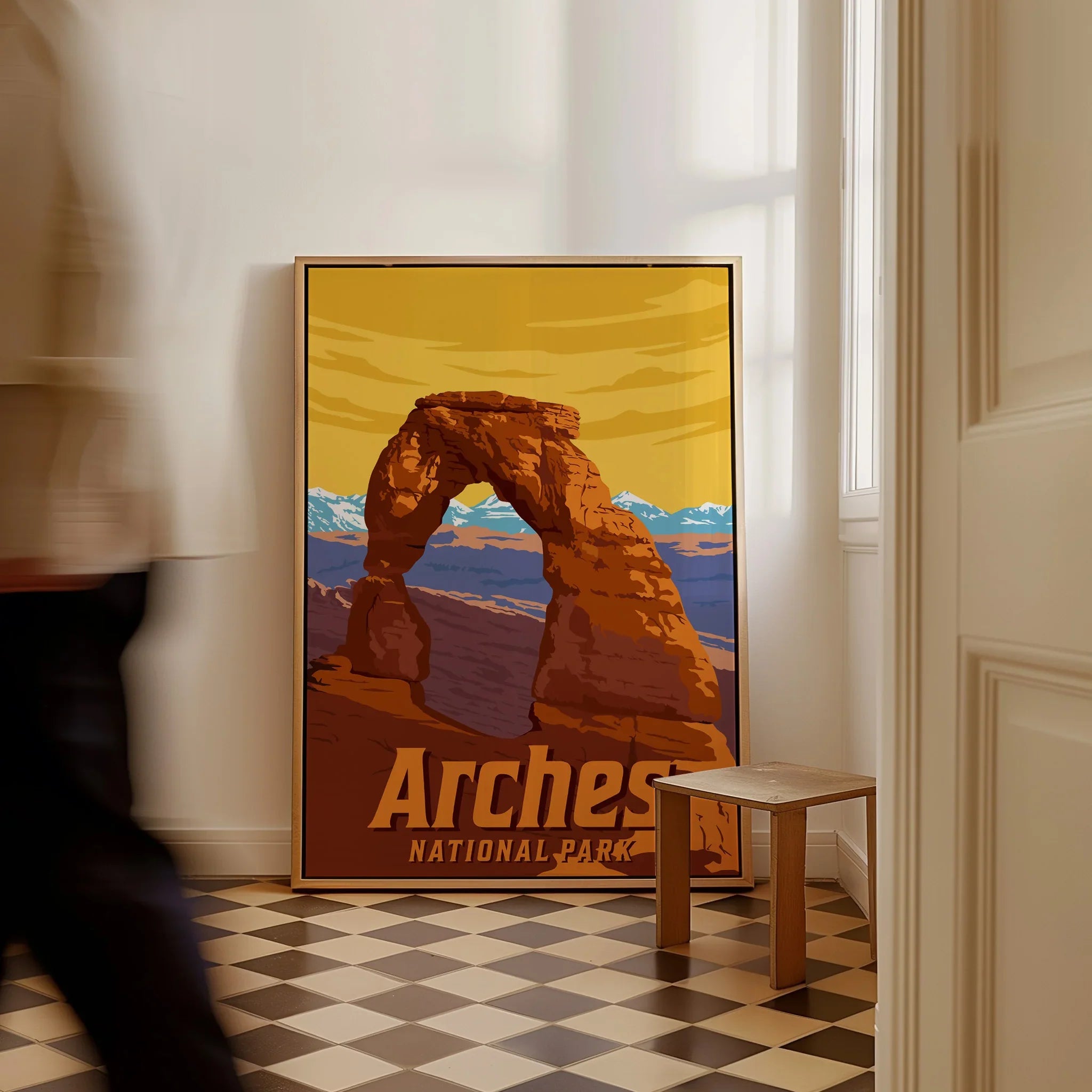 Framed Arches National Park travel poster with Delicate Arch illustration on checkered floor