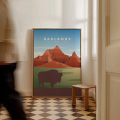 Framed Badlands National Park art print with bison and mountains, leaning on floor