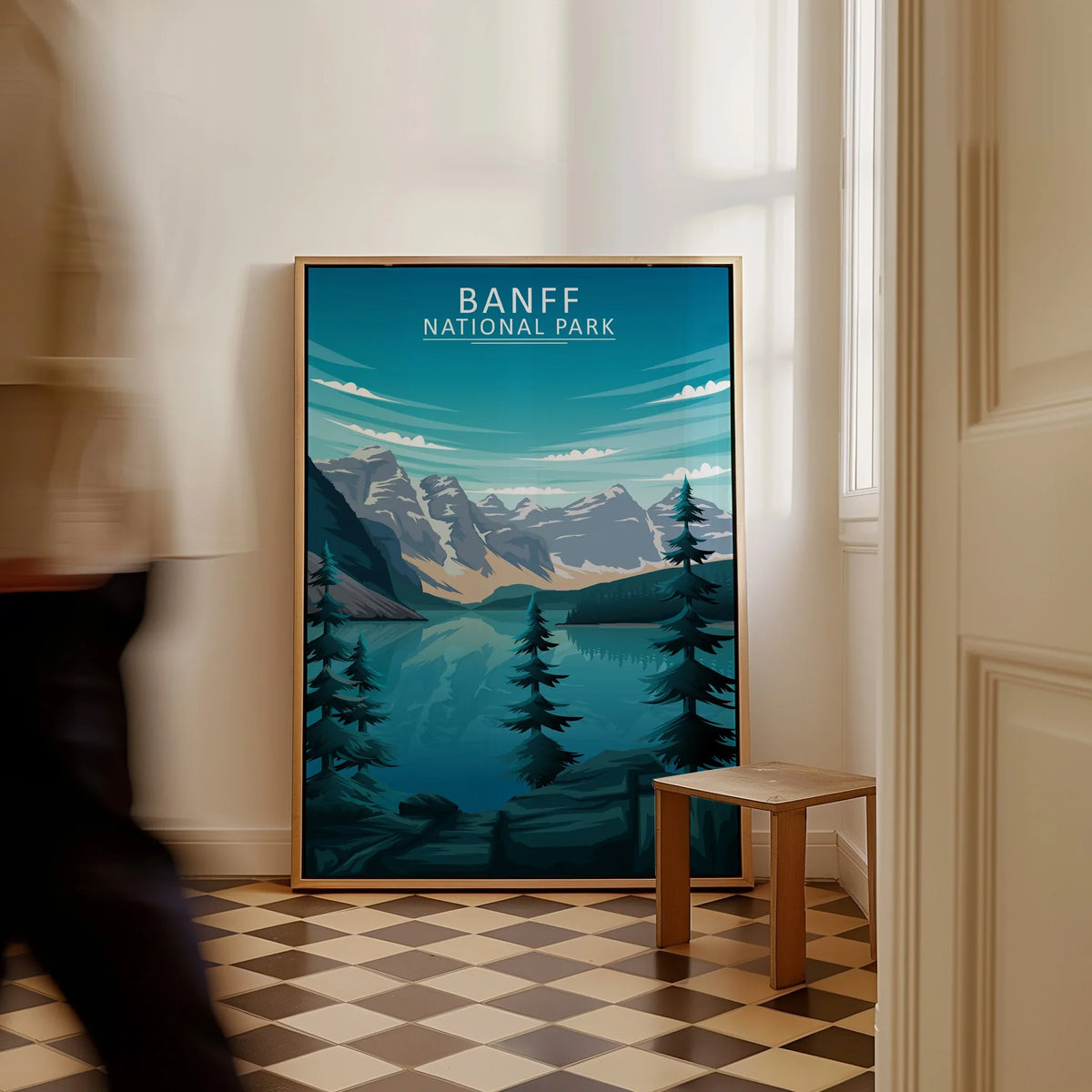 Framed Banff National Park art print with mountains and lake, leaning on floor in hallway