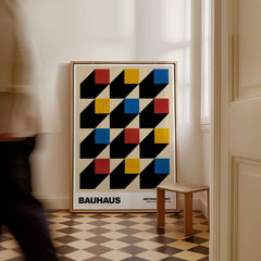 Bauhaus Exhibition Prints - Isometric Cubes Art Print Red Yellow Blue Design displayed in a stylish interior with geometric pattern.