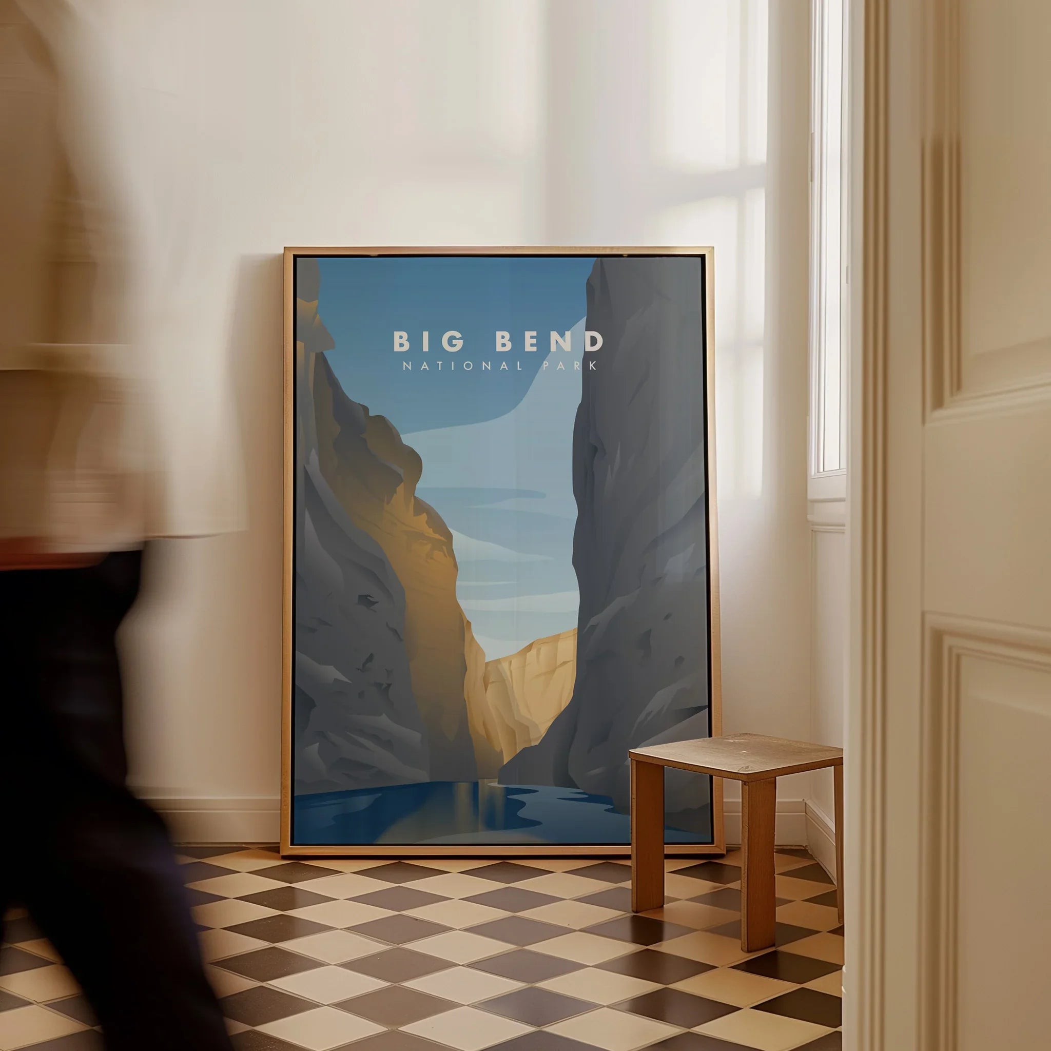 Framed Big Bend National Park travel poster on floor in modern home entryway