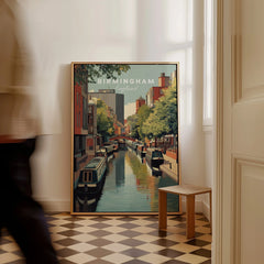 Framed Birmingham England travel poster on floor, canal scene, man walking past, modern decor