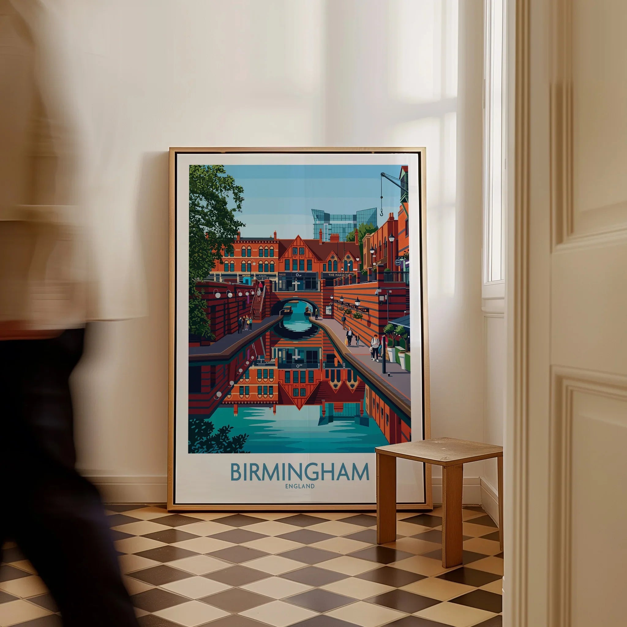Framed Birmingham England cityscape art print on checkered floor with man walking past