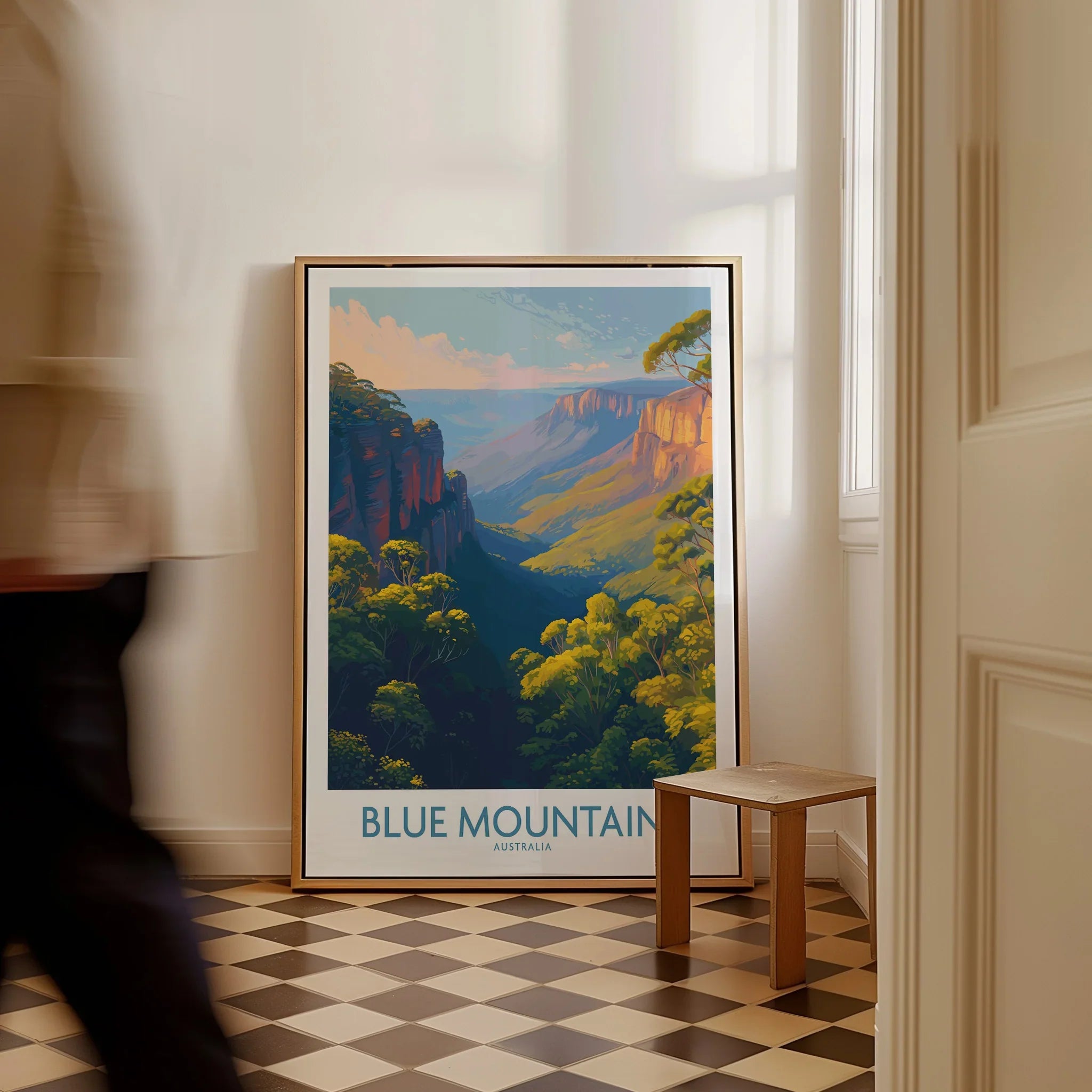 Framed Blue Mountains Australia travel poster on floor in modern hallway with natural light