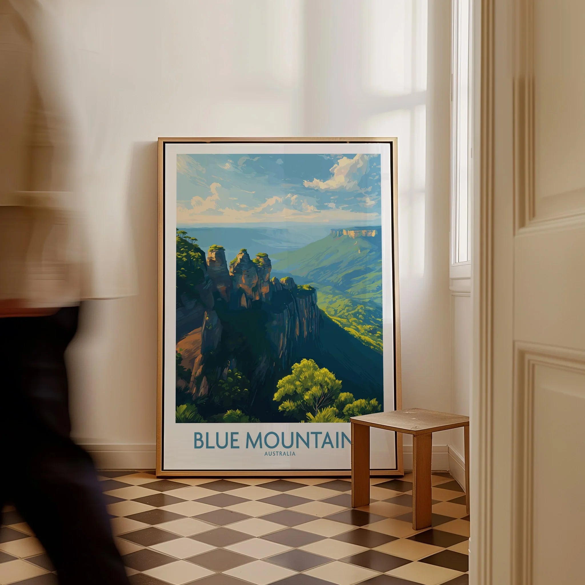Framed Blue Mountains Australia travel poster on checkered floor in bright hallway