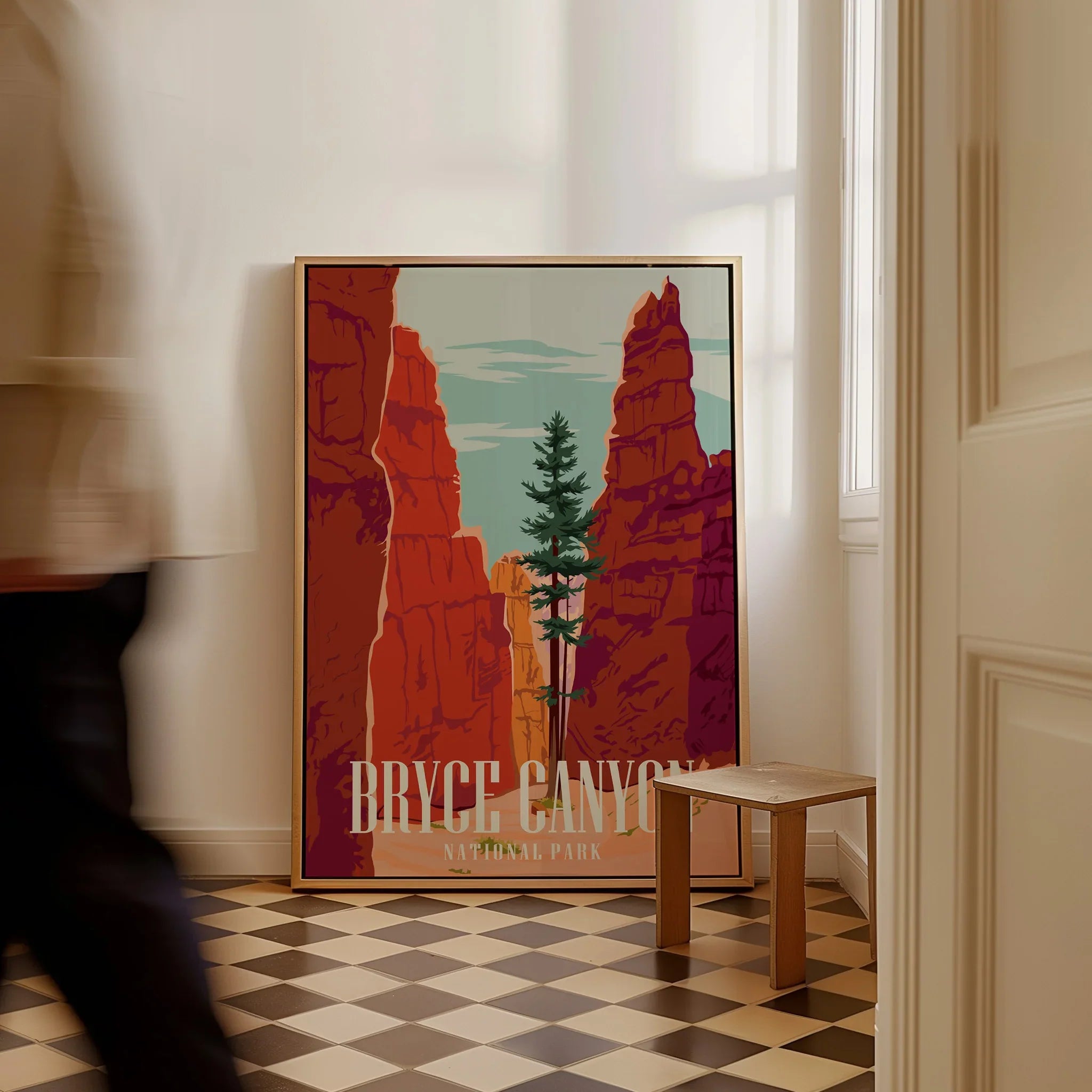 Framed Bryce Canyon National Park travel poster leaning on floor in modern hallway